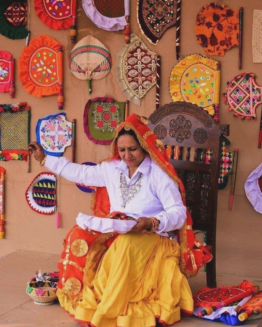 Woman embroidering in a TRINJAN editorial heritage portrait